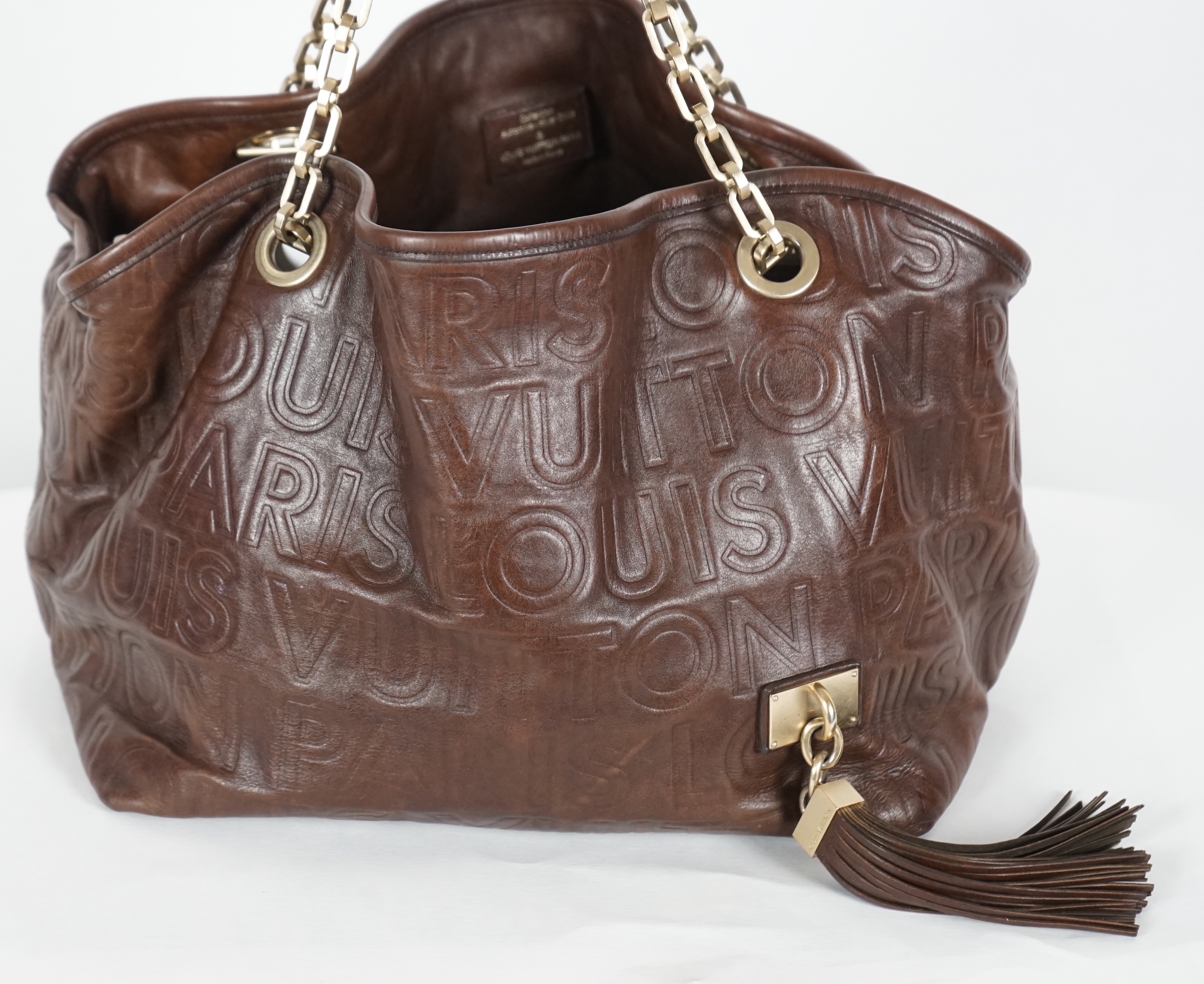 A Louis Vuitton brown Paris Souple Whisper shoulder bag, width 31cm, height 26cm, depth 22cm